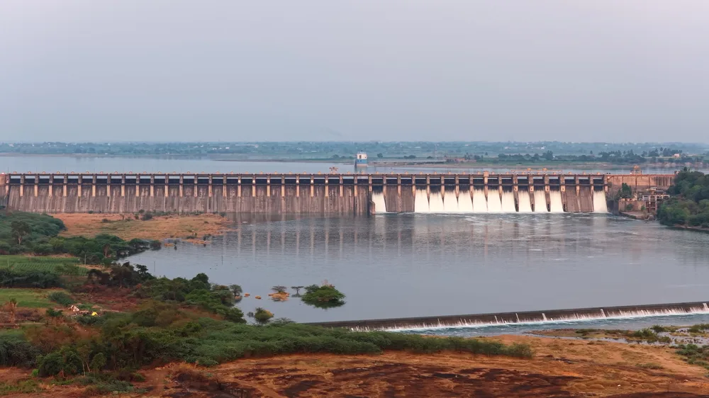 Aerial view of a dam and reservoir in rural India at evening light